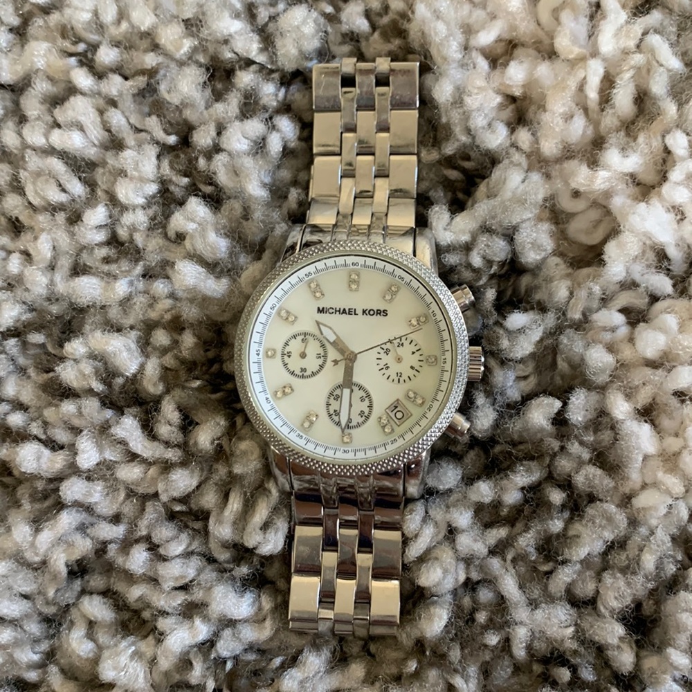 Michael Kors silver watch with pearl face, scratches as shown